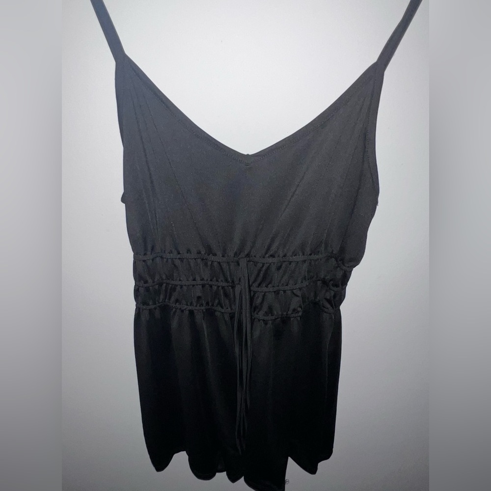 Plain black medium one piece romper.